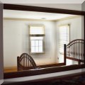 DM01. Large wood-framed wall mirror. 